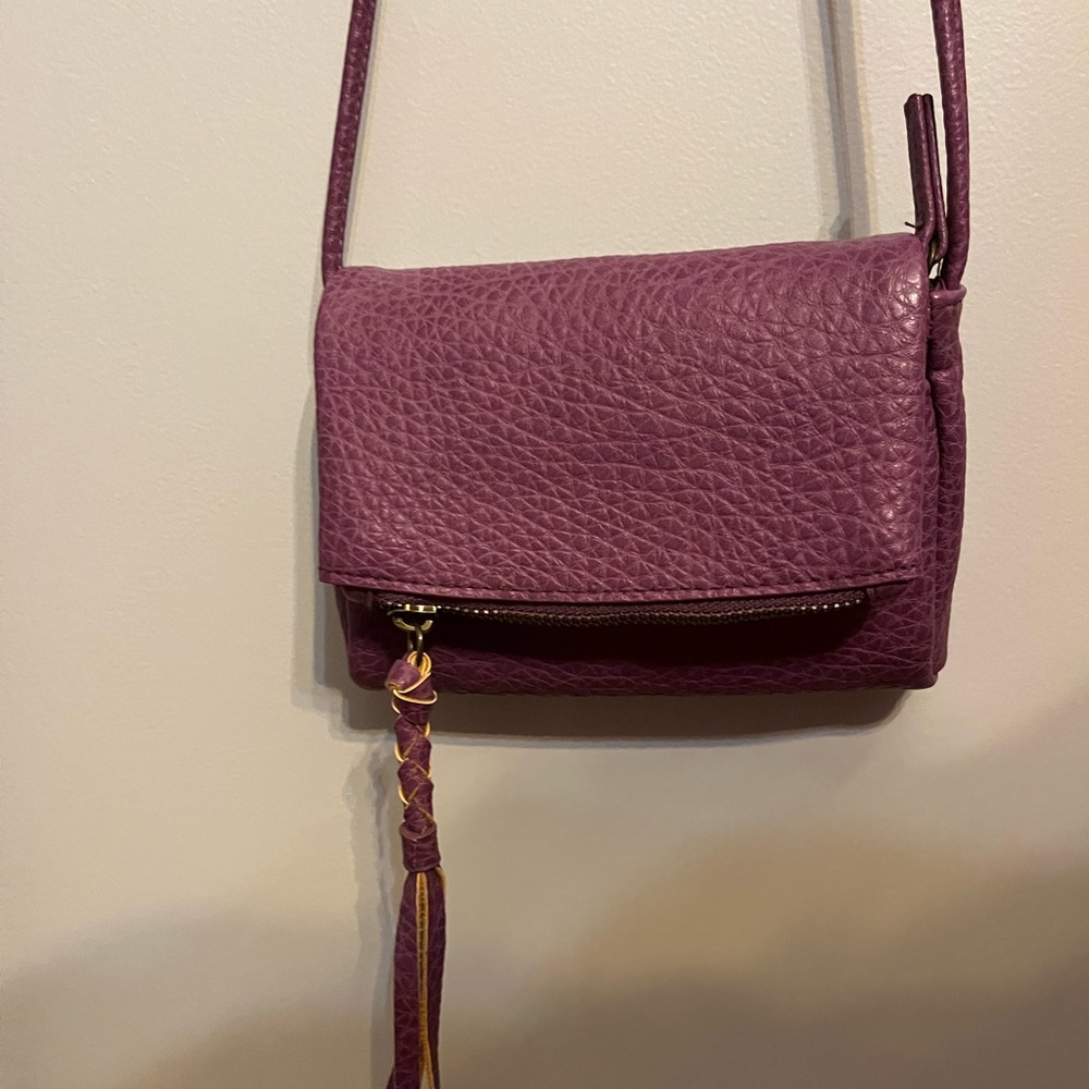 Small purple crossbody fold over purse.